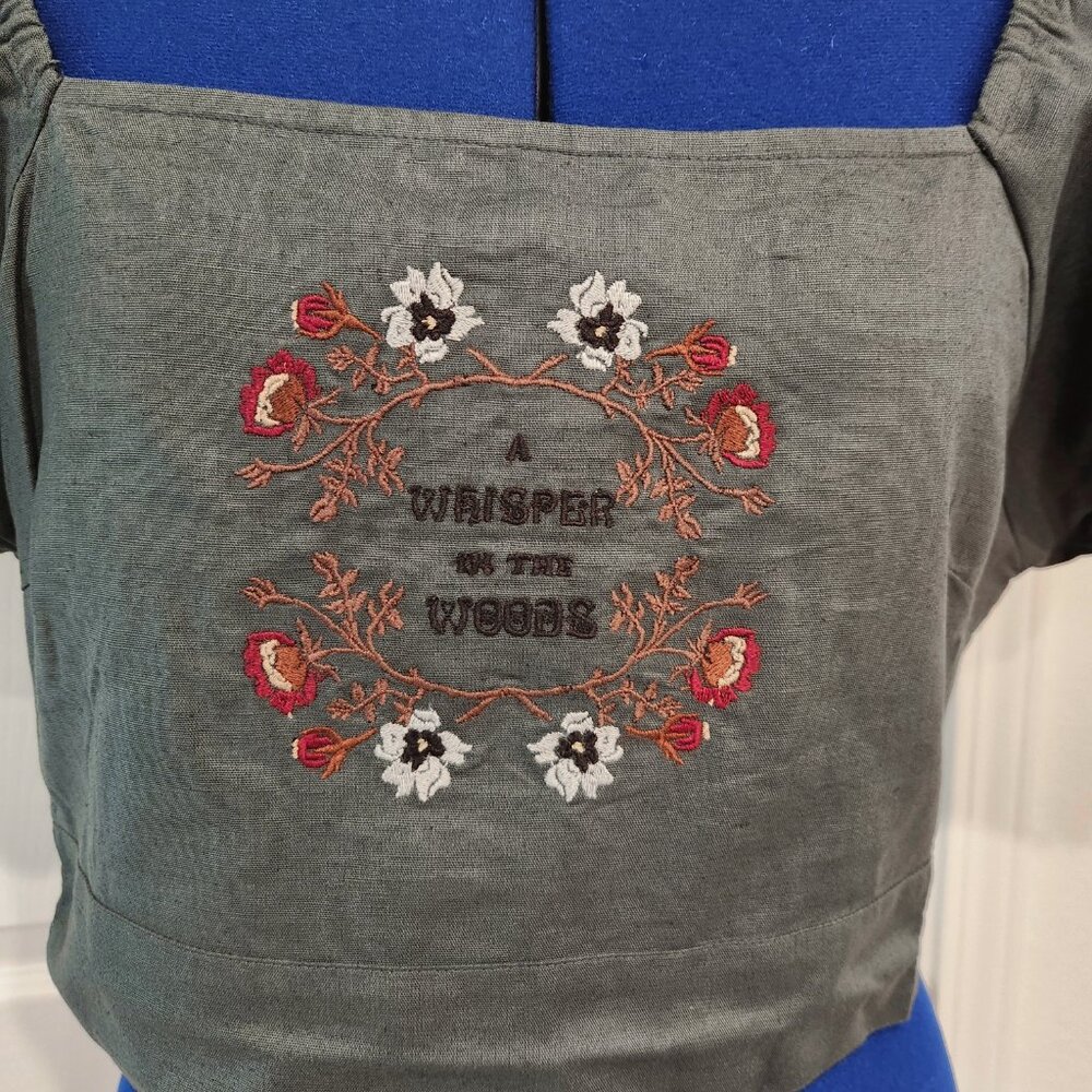Crop top with embroidered floral design, puffy sleeves, and ruched back size 6